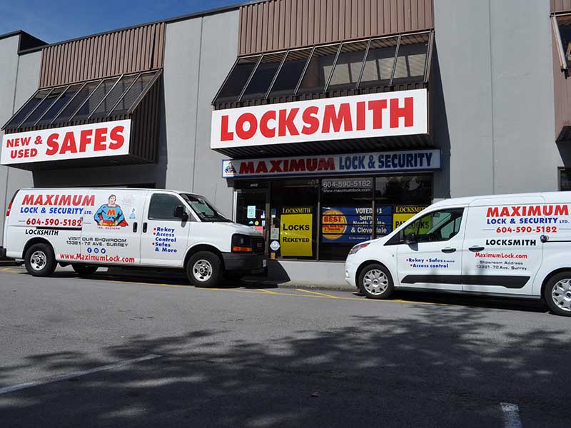 Maximum Lock & Security store front with business vehicles parked outside